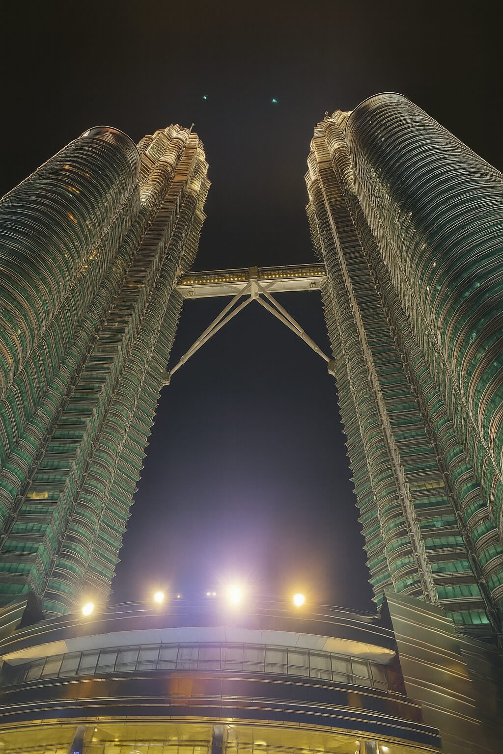 Looking up at the Petronas Towers from their base
